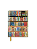 A hardcover planner or journal featuring a vintage bookshelf cover design with rows of colorful illustrated books and a gold ribbon bookmark hanging from the bottom. The year '2027' is printed in gold near the top right.
