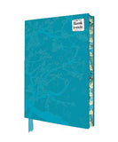 A turquoise blue notebook with a subtle tree branch pattern on the cover, featuring a white 'Blank Inside' sticker on the top right and a matching blue ribbon bookmark hanging from the bottom edge. The book is shown at a three-quarter angle against a plain white background.