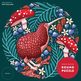 Round puzzle packaging with a red kiwi bird and mushrooms on a dark green background