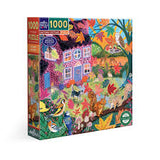 Jigsaw puzzle box with colorful design of a cottage and nature elements on a white background