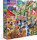 Jigsaw puzzle box featuring a colorful illustration of a London market scene with various products and people.