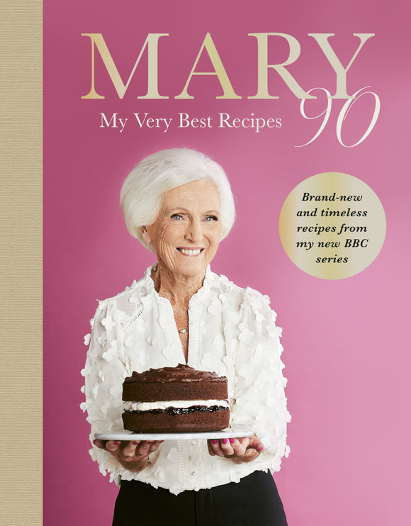 Book cover featuring a woman holding a cake with text about her recipes.