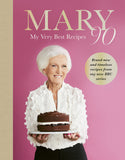 Book cover featuring a woman holding a cake with text about her recipes.