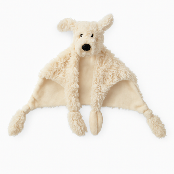 Plush toy dog with a blanket on a white background