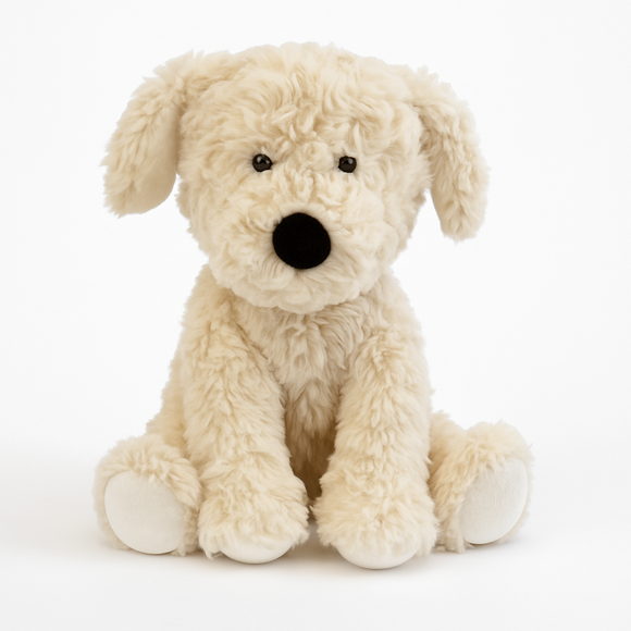 Cuddly beige plush dog toy on a white background