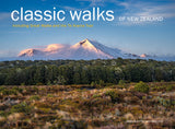 Cover of a walking calendar titled 'classic walks OF NEW ZEALAND' featuring a scenic landscape of a snow-capped mountain, a dark green forest, and a grassy foreground under a blue sky.