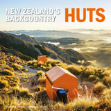 A scenic wall calendar cover titled 'NEW ZEALAND'S BACKCOUNTRY HUTS' showing two bright orange mountain huts in a misty mountain valley at sunrise. The text 'Pottora & Burton calendars / 2027' appears in the lower-left corner.